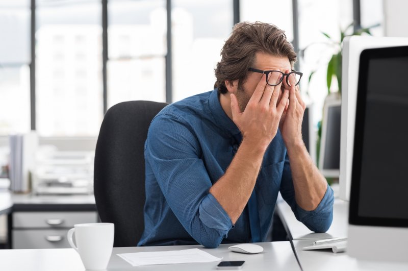 man showing fatigue at work 